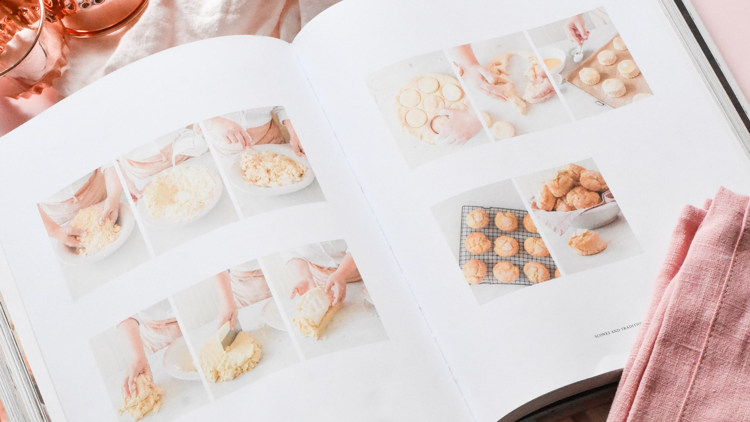 Open cookbook with scone recipe on a pink surface